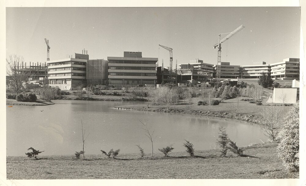 Chapel Lake with Library and I Block under construction 1975