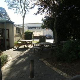 Picnic tables near groundmen's workshop.