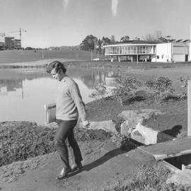 Student walking past Oranga Lake