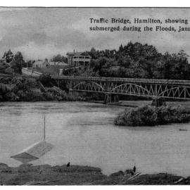 Traffic Bridge Hamilton. Showing the boat shed submerged during the floods in January 1907.